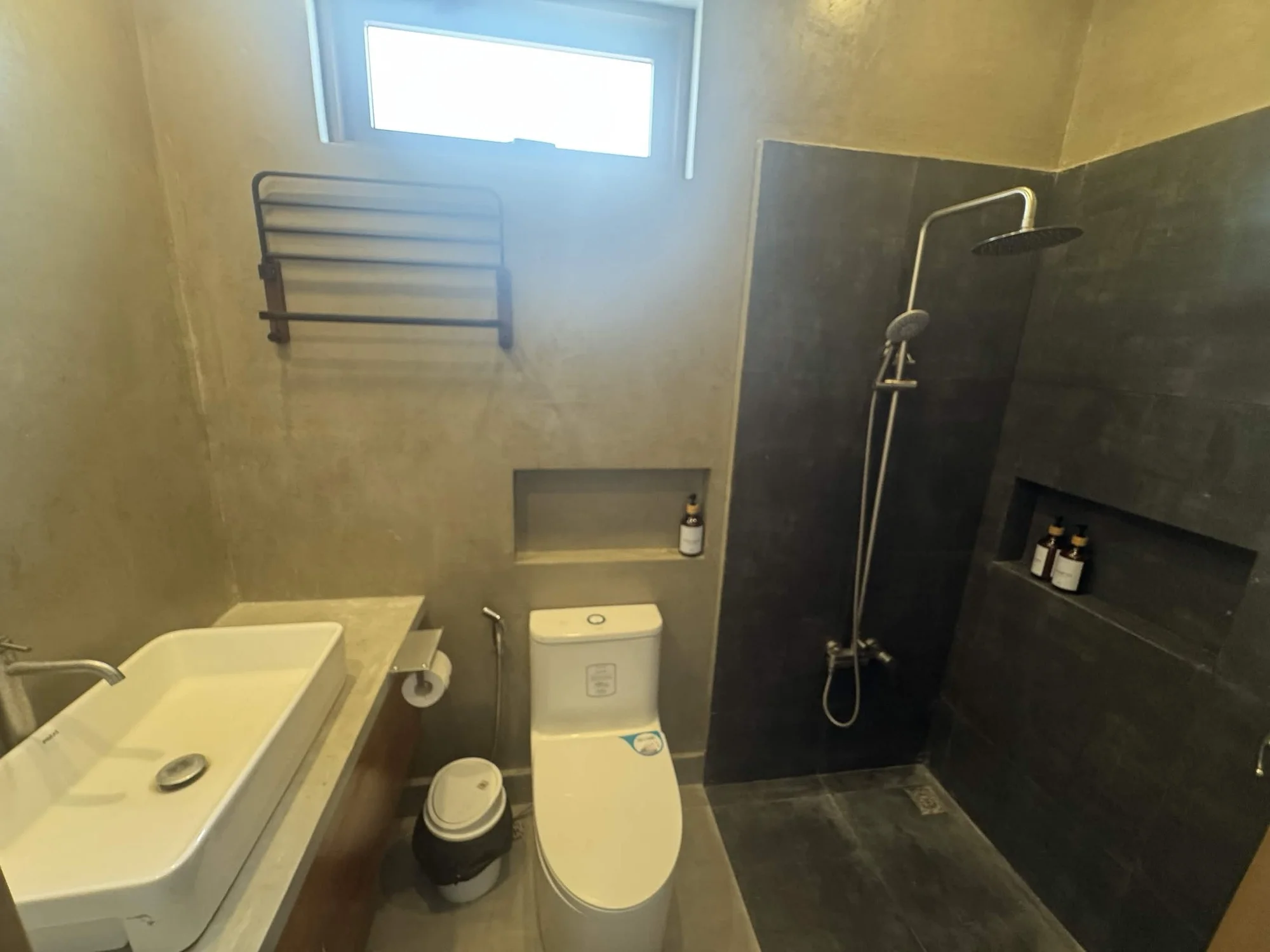 Second bathroom with microcement walls, vessel sink, walk-in rain shower and slate tile